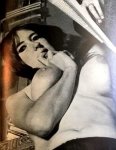 Shot of busty woman biting her arm